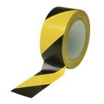 Roll of yellow floor marking tape by Jeewa Plastic Roll of black floor marking tape by Jeewa Plastic Yellow and black striped safety zone tape on concrete floor Warehouse aisle marked with floor marking tape Factory safety zone delineated by high-visibility tape Office floor walkway marked with black floor tape Close-up of floor marking tape textured surface Floor tape applied around machinery for hazard zone Adjacent black and yellow tape lanes in a storage area