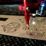 CO₂ Laser Engraving & Cutting Machine 1300×900 mm by Jeewa Plastic Laser Engraving Cutting Machine spacious work area view by Jeewa Plastic Control panel of the Laser Engraving & Cutting Machine by Jeewa Plastic Laser machine cutting an acrylic sheet sample by Jeewa Plastic Laser machine engraving a wooden panel sample by Jeewa Plastic Laser machine engraving a leather sample by Jeewa Plastic